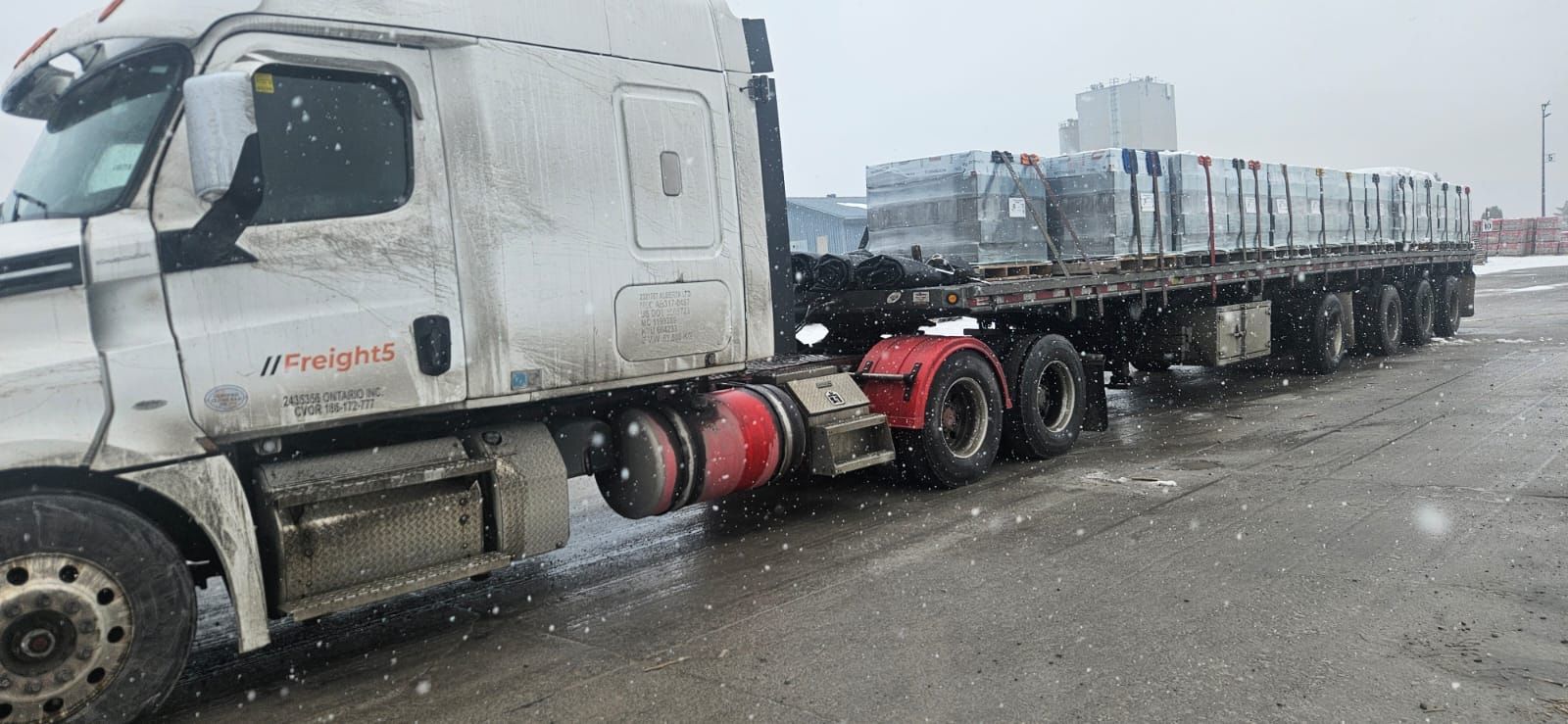 Freight5 flatbed truck hauling freight in Ontario winter conditions